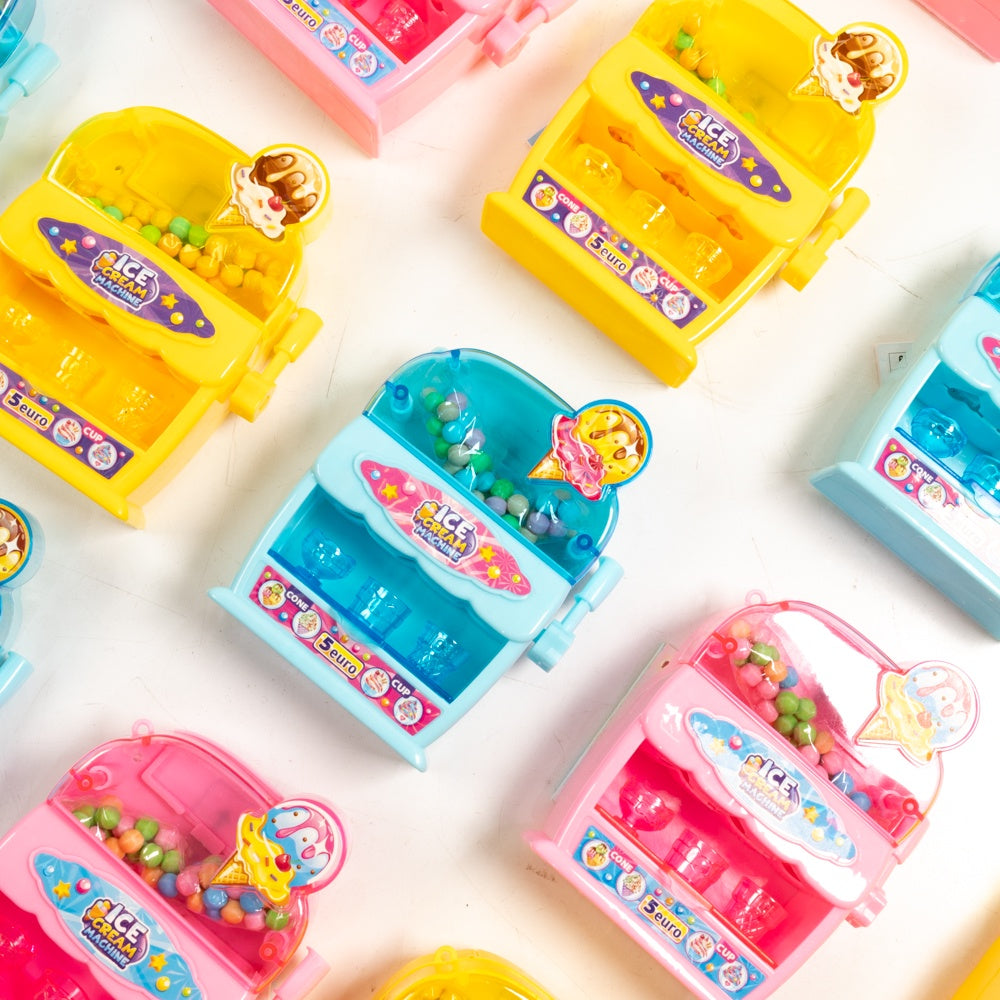 Colorful toy ice cream makers on a white background