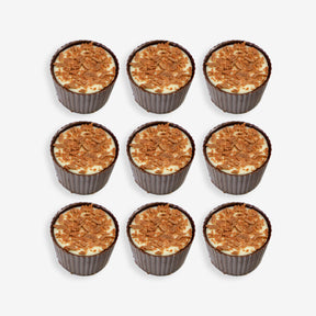 Nine cupcakes with a crumbly topping arranged in a 3x3 grid on a white background.
