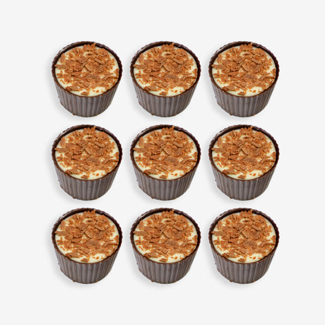 Nine cupcakes with a crumbly topping arranged in a 3x3 grid on a white background.