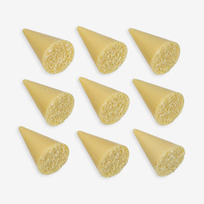 Nine yellow conical objects on a white background
